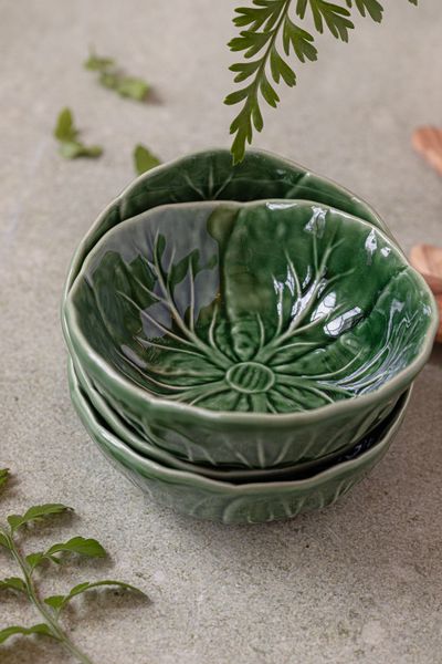Leaf-embossed stoneware bowls in moss green — photo by Micheile Henderson on Pexels