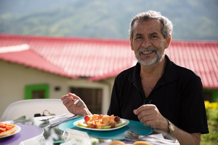 Smiling Man Holding A Fork 