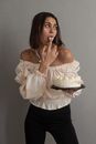 Woman in White Off Shoulder Blouse Holding a Cake