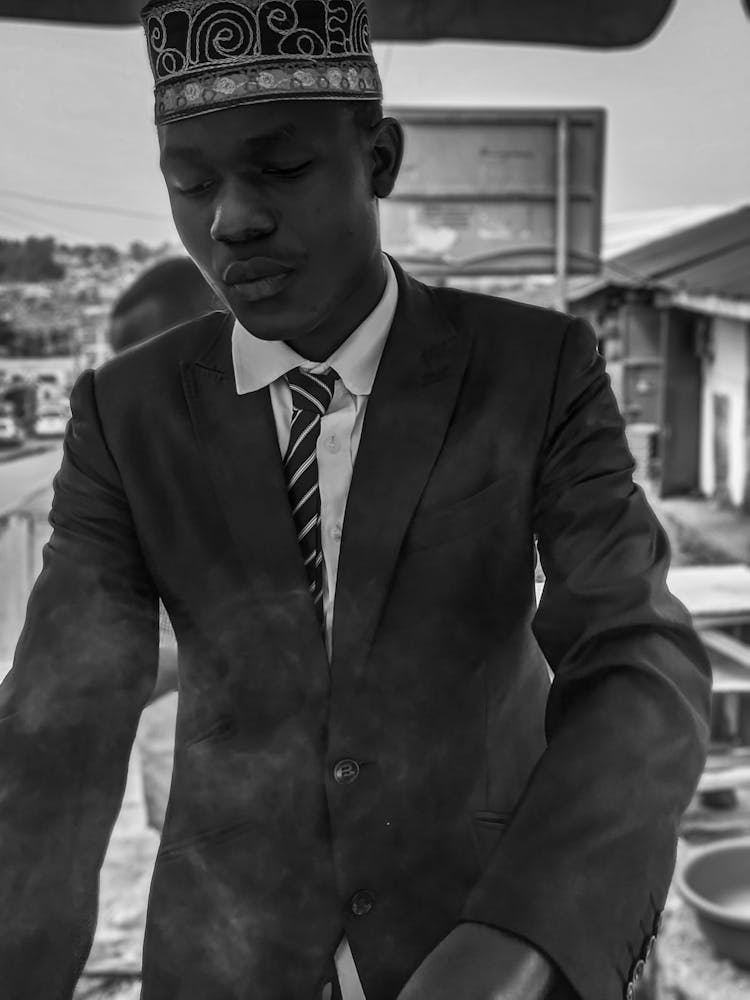 Man In Suit And Traditional Hat