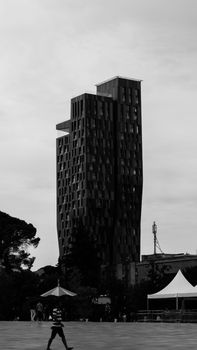 Striking black and white photo of a modern high-rise building in Tirana, Albania.