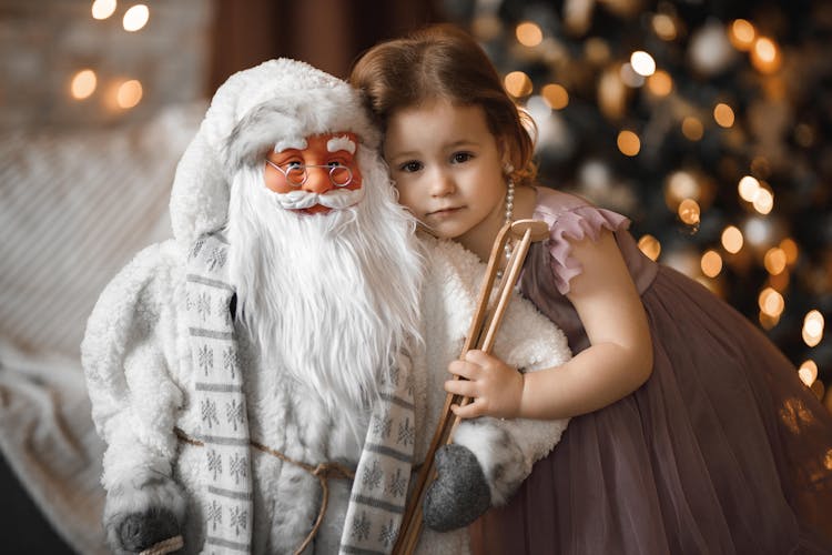 Cute Girl Near A Santa