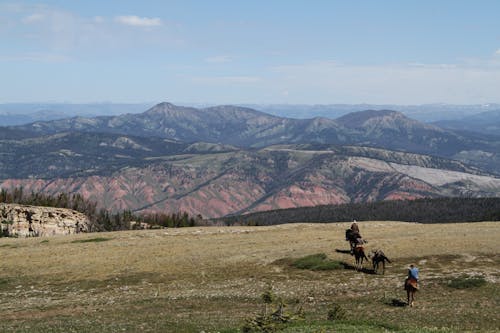 People Riding Horses in the Mountain