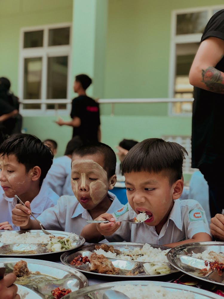 Boys Eating School Dinner