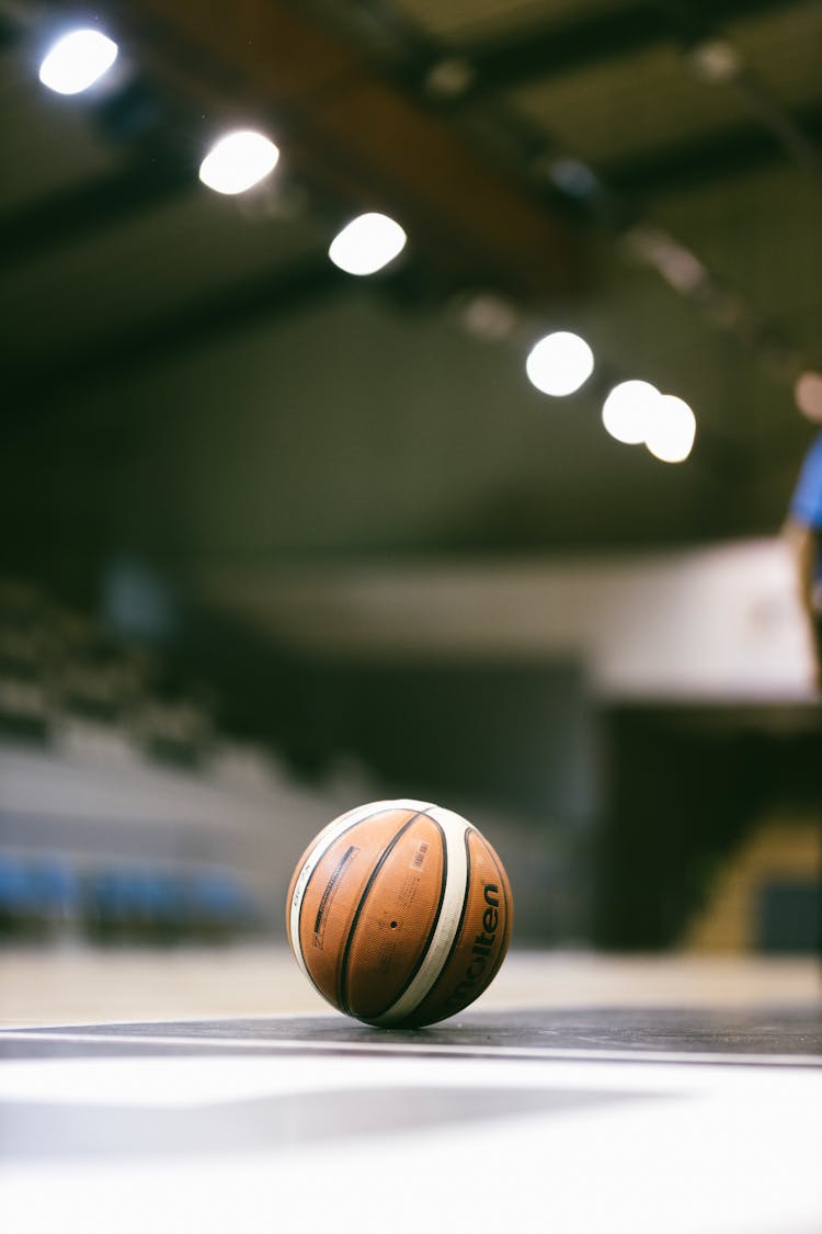 Basketball Laying On Floor At Court