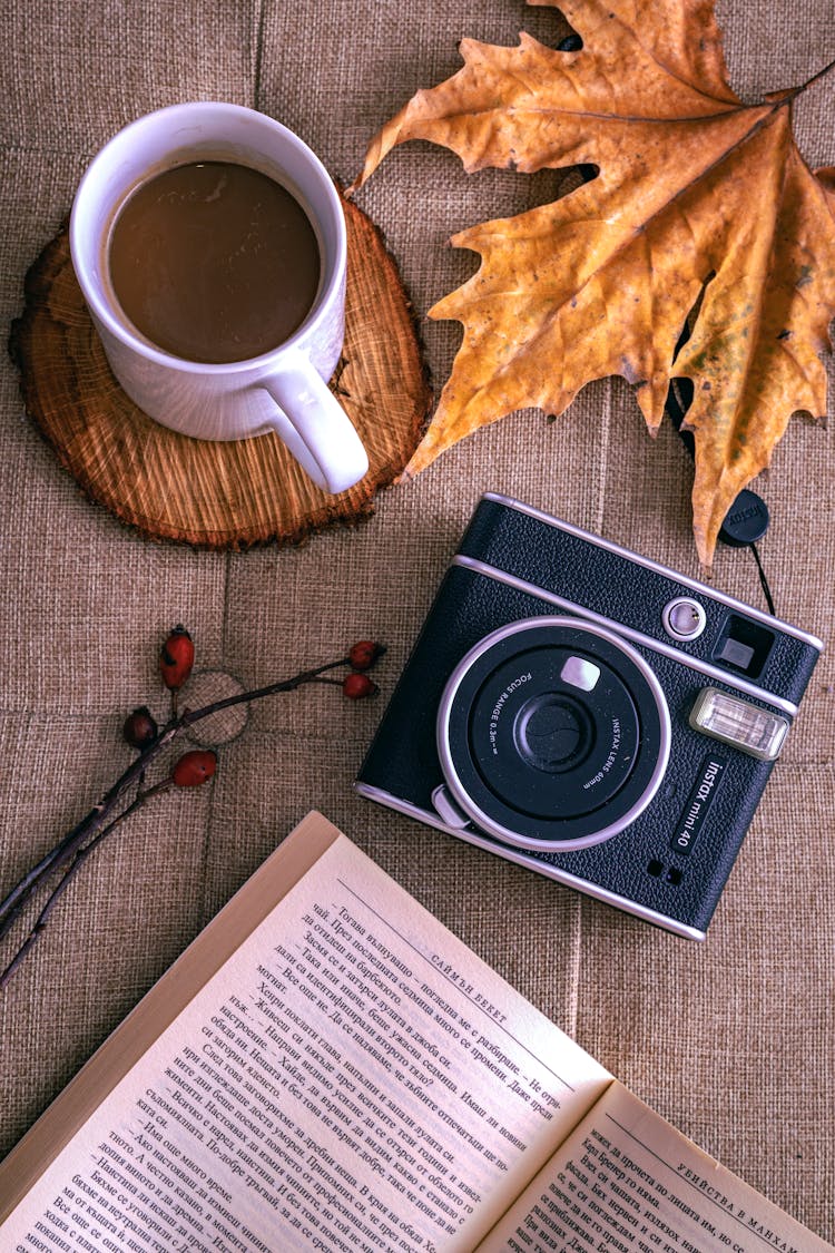 A Cup Of Coffee On A Wooden Coaster