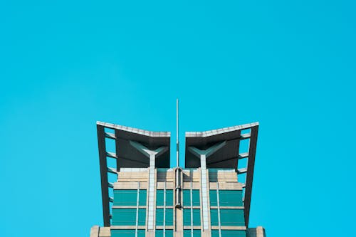 Foto profissional grátis de arranha-céu, céu azul, construção