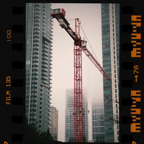 Red Crane near High Rise Buildings in the City