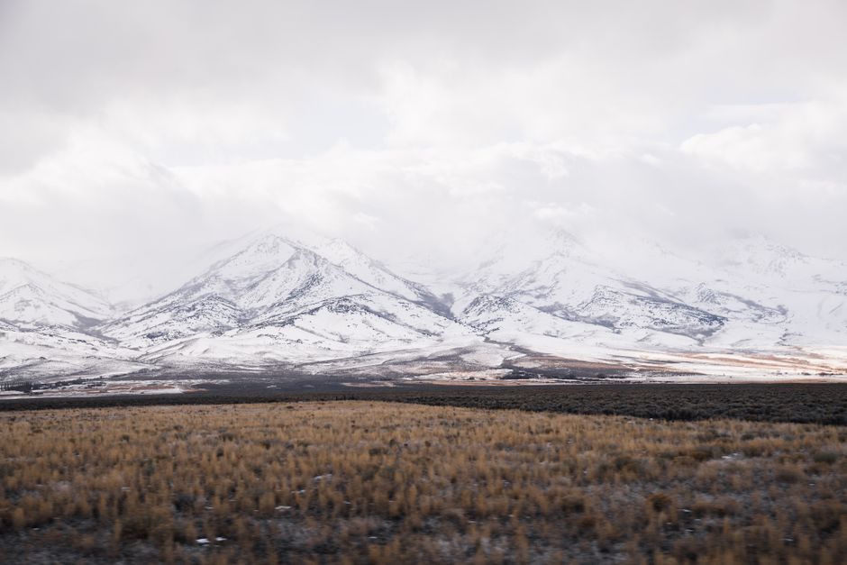 Serene snow-covered mountains in Nevada's rural landscape. Perfect for nature and adventure photography.