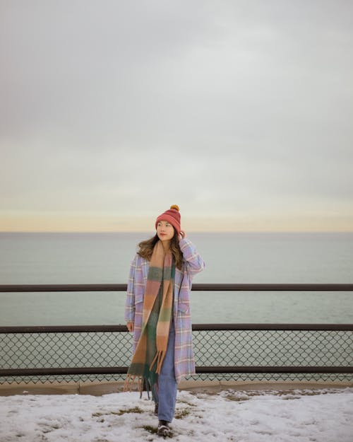 Free Woman Standing on Pier in Winter Stock Photo