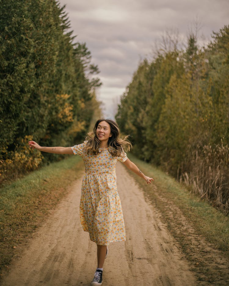 Smiling Woman Running On Forest Path