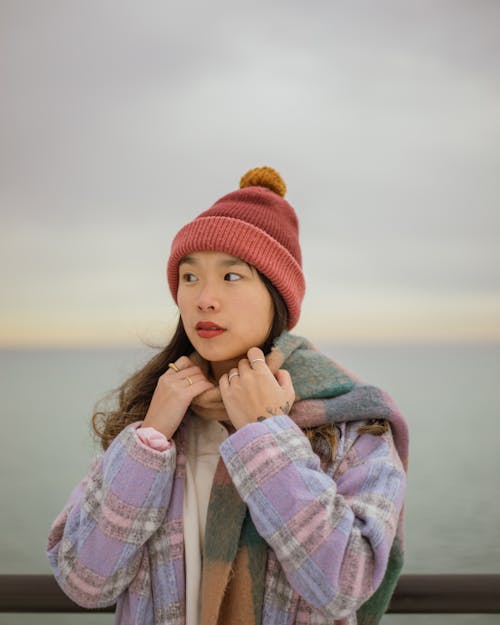 Woman in Winter Hat and Scarf Looking Around