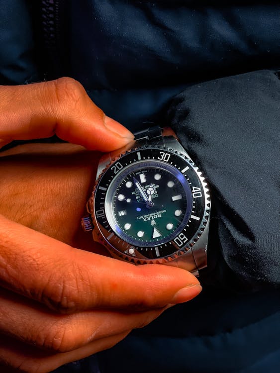 Free Holding a Rolex Watch Stock Photo