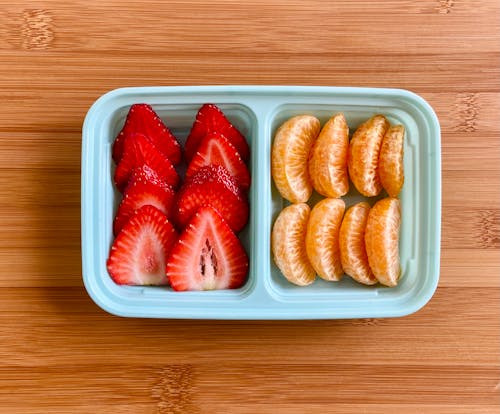 Free Strawberries and Oranges on a Plastic Tray Stock Photo