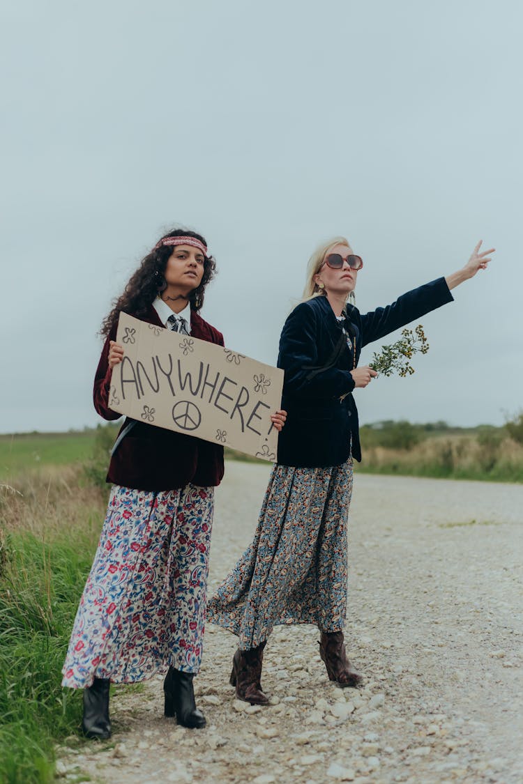 A Woman Holding A Poster