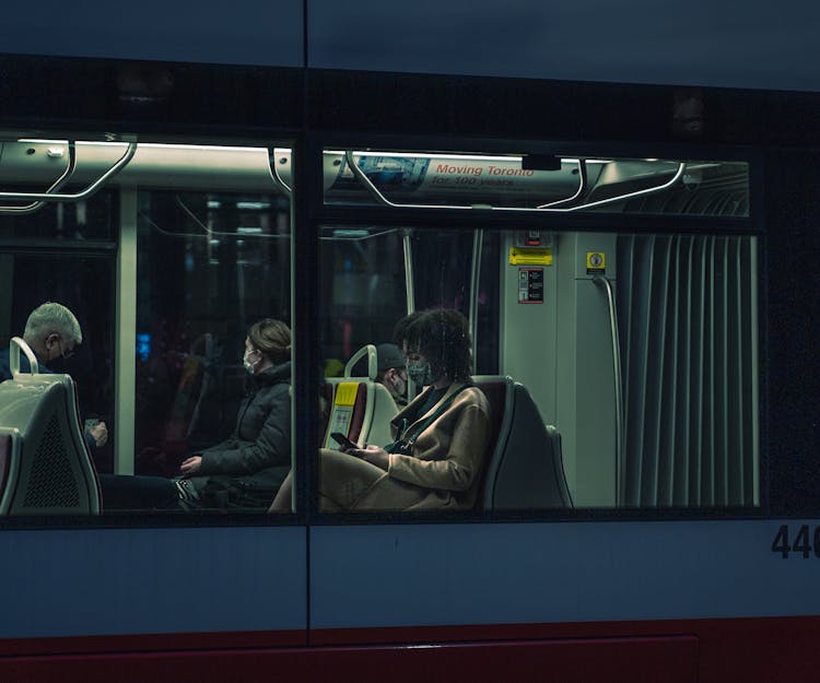 People On Bus At Night