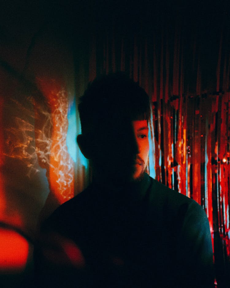 Young Man In Colourful Lighting 