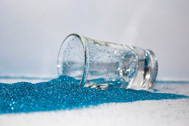 Shot Glass Over Turquoise Colored Glitter 