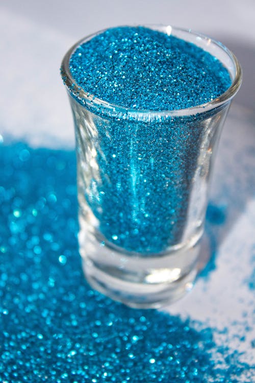 Blue Glitters in Clear Drinking Glass