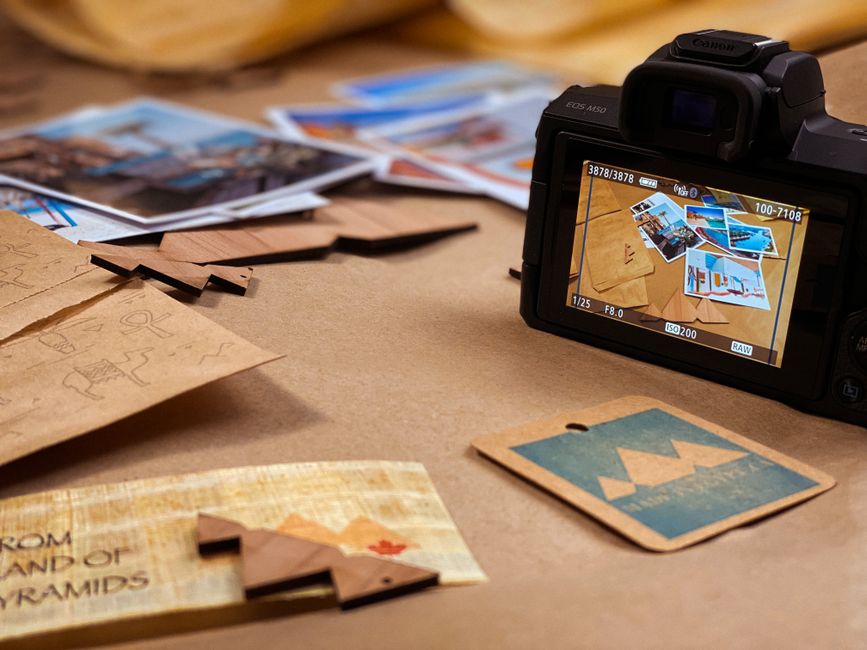 Travelers vs Hartford: Home Insurance for Older Houses With Outdated Systems Camera and printed photos arranged on a desk for creative photography exploration.