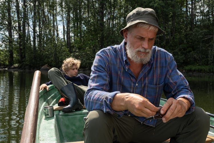 Grandfather And Grandson In Boat