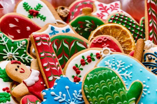 Close-up of assorted festive Christmas cookies topped with colorful icing, perfect for holiday celebrations.