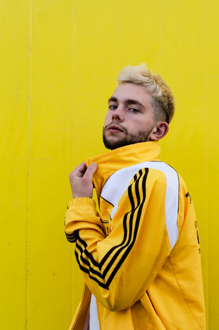 
A Bearded Man Wearing A Yellow Tracksuit