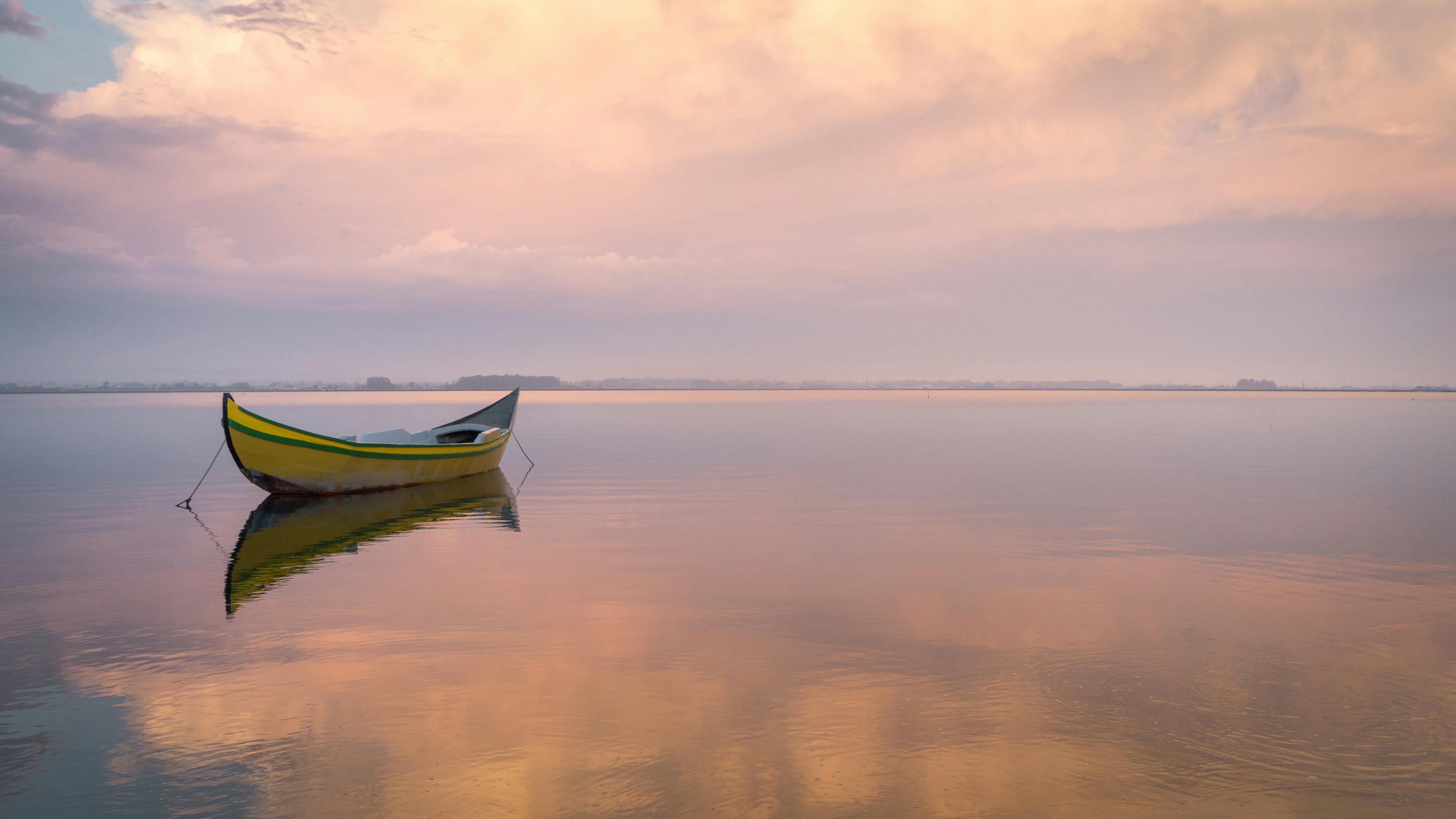 Wooden Small Boat Floating on a Calm Water · Free Stock Photo
