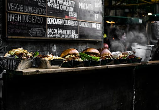 A mouth-watering display of burgers at a bustling London street food market.
