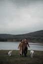Couple with Dogs on Leashes