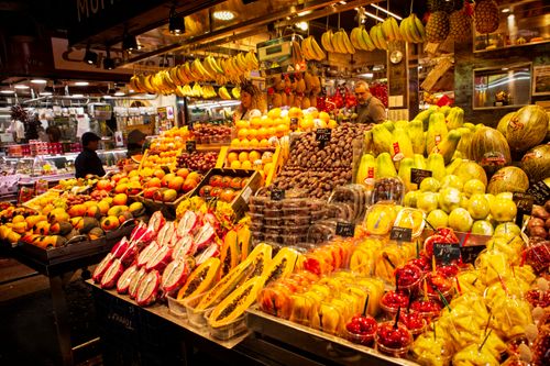Free Colorful fresh fruit display at a lively local market stall, showcasing diverse produce. Stock Photo