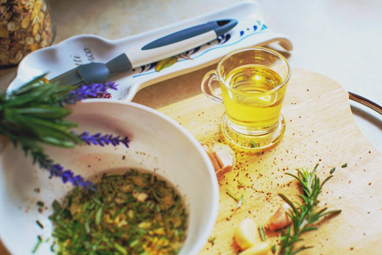 Cup Of Oil Next To A Bowl 