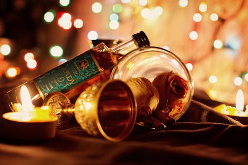 Cognac Bottle and Glass in Candlelight