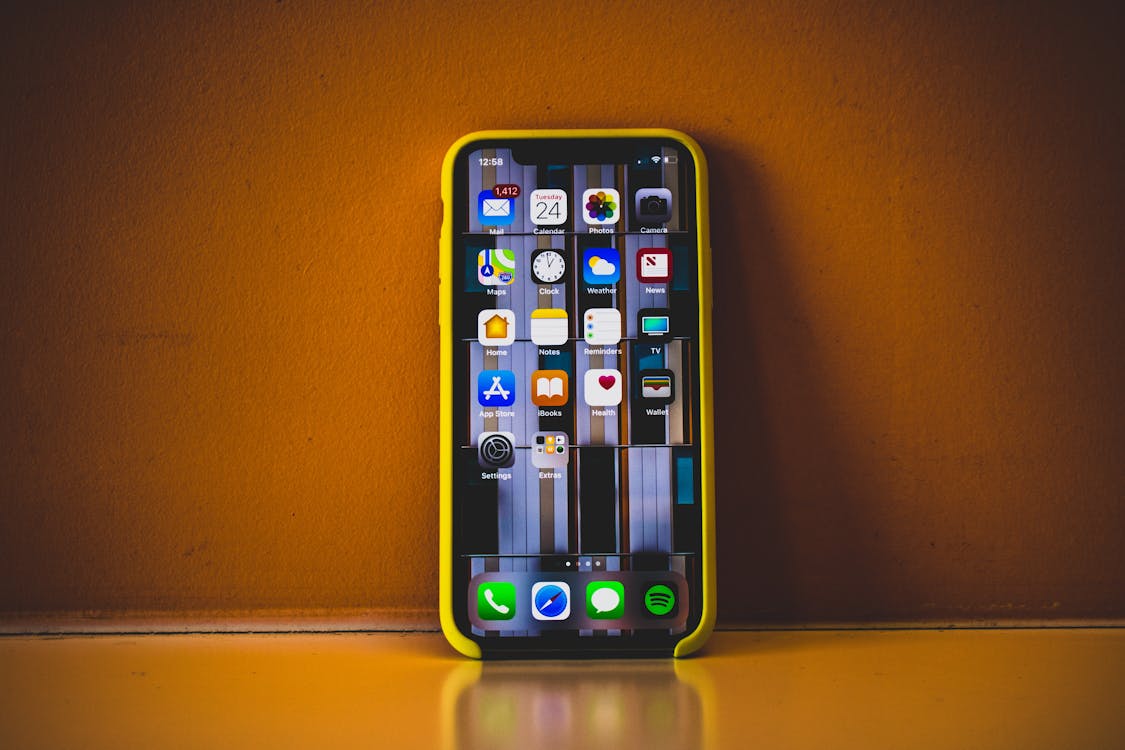 Free Turned on Iphone X With Yellow Case Stock Photo
