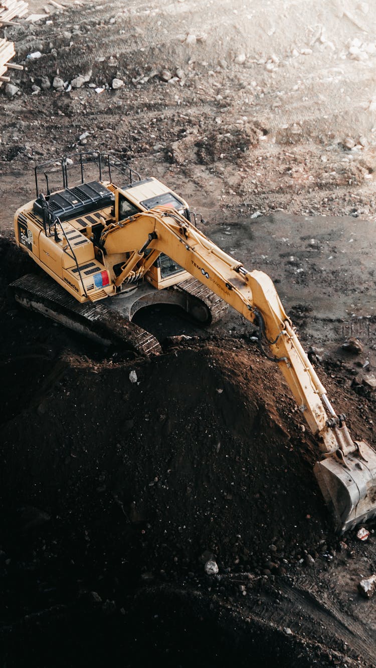 A Heavy  Machine Digging On Soil