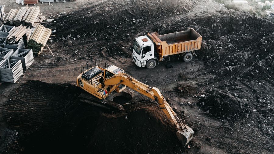 Excavator loading a dump truck, seen from above