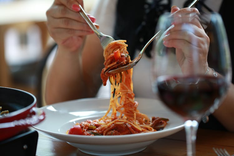 A Person Eating Spaghetti