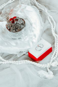 Close-up of wedding rings and decoration, showcasing elegance and style for wedding photography.