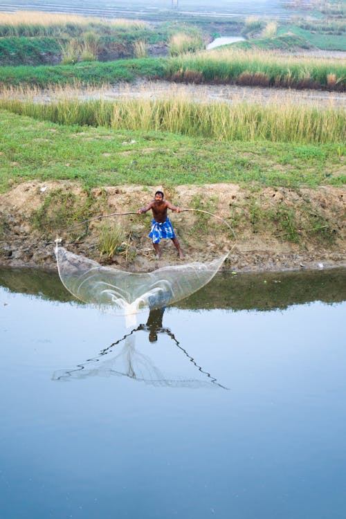 Foto profissional grátis de fundição, pescador, pescaria