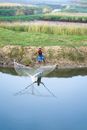 A Fisherman Casting a Net