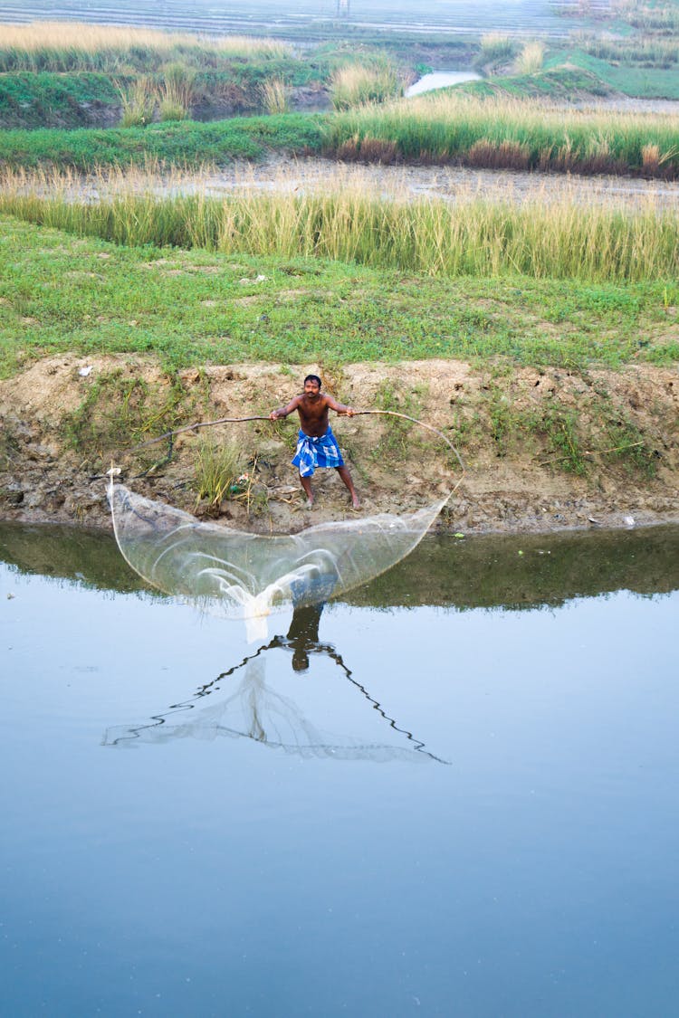 A Fisherman Casting A Net