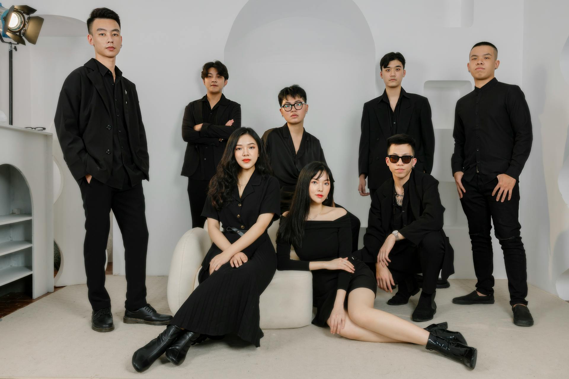 Group of People in Black Outfits