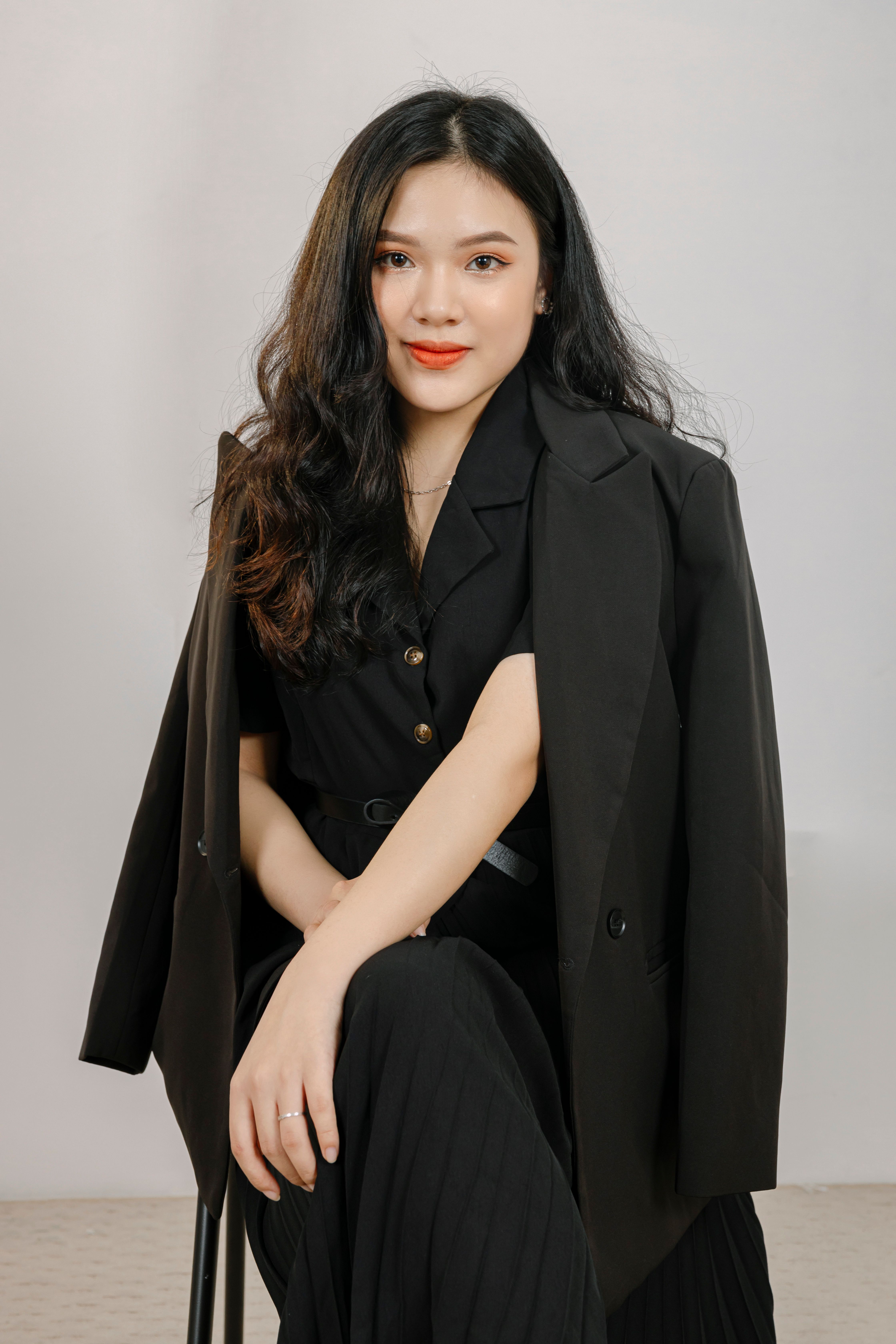 A Woman in Black Coat Sitting on the Chair · Free Stock Photo