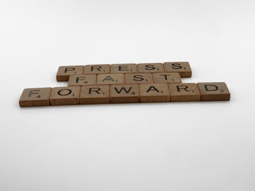 Free Press Fast Forward Spelled on Scrabble Pieces Stock Photo