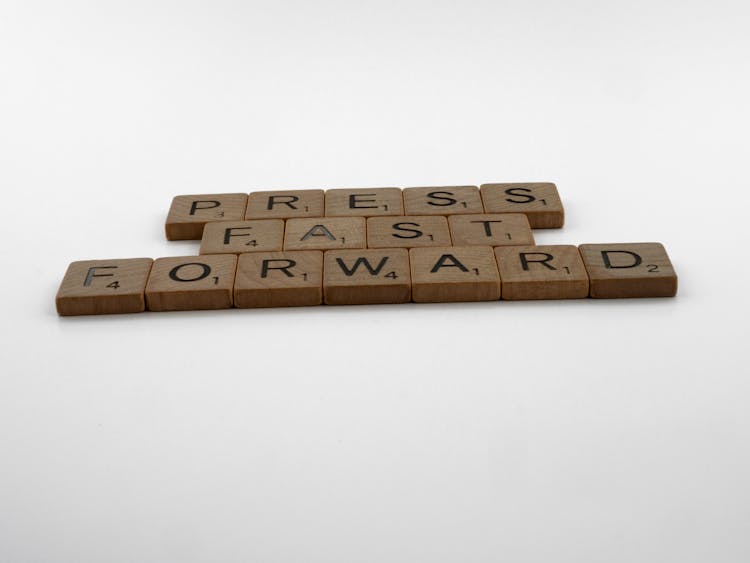 Press Fast Forward Spelled On Scrabble Pieces