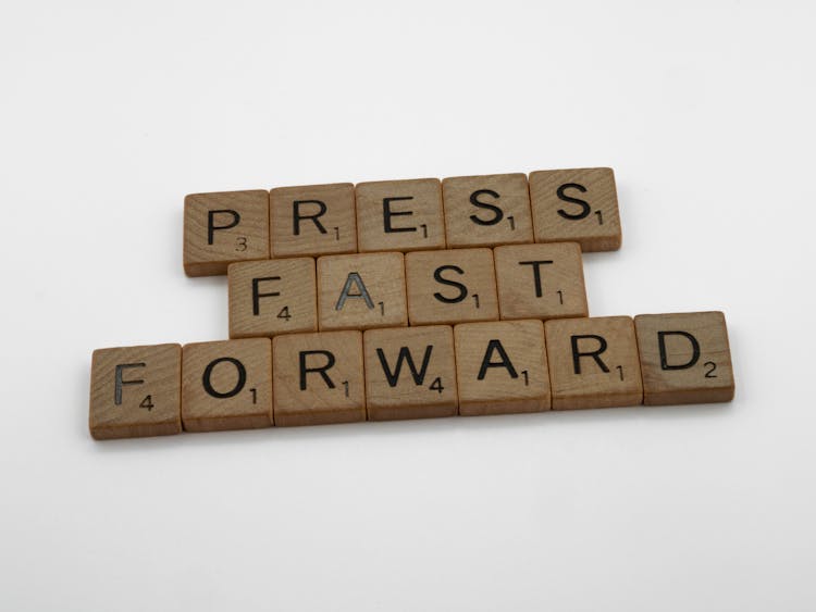 Press Fast Forward Spelled On Scrabble Pieces
