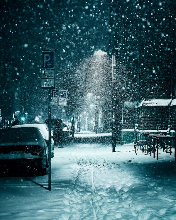 Photo of an Empty Street on a Snowy Night · Free Stock Photo