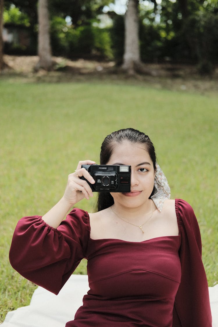 Woman Taking Picture With Camera