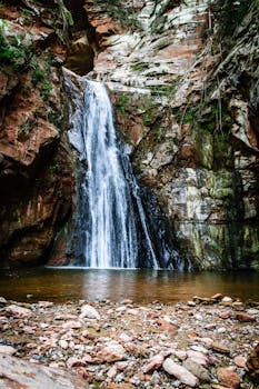 Beautiful waterfall cascading over rugged rocks in Aguaray, Salta, Argentina.
