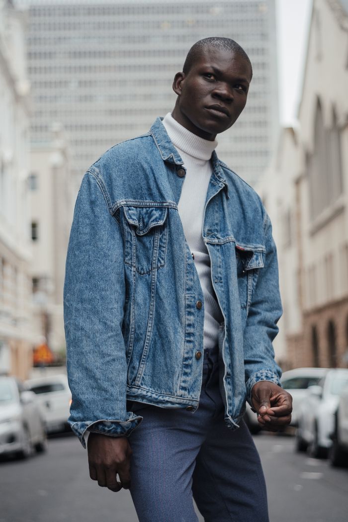 Man in a denim jacket on an urban street — Thomas Nguka on Pexels